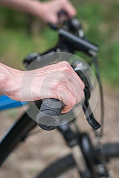 Relax on a mountain bike ride along the forest path. Sports and the concept of active life in the summer. Horizontal frame