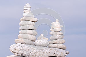 Relax nature concept stack of white pebbles stone against sea background for spa balance meditation and zen theme