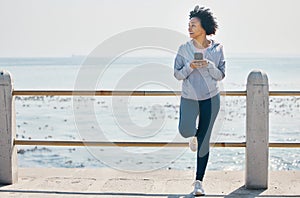 Relax, phone and fitness with black woman at beach for running, workout and tracking app. Network, communication and