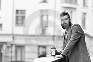 Relax and recharge. Man bearded hipster drinking coffee paper cup. One more sip of coffee. Enjoying coffee on the go