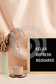 Relax, refresh, recharge, motivational quote on letter board