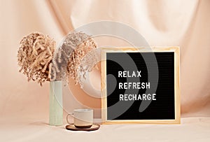 Relax, refresh, recharge, motivational quote on letter board