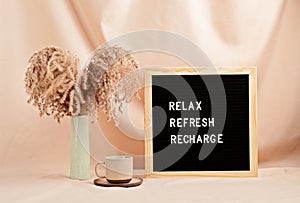 Relax, refresh, recharge, motivational quote on letter board photo