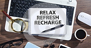 Relax, Refresh, Recharge on notepad
