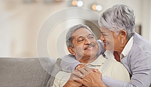 Relax, retirement and senior Mexico couple on sofa at home enjoying free time with smile, hug and love. Happy