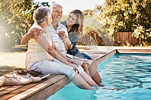 Relax, senior couple and woman with feet in swimming pool enjoying summer holiday, vacation and weekend. Family, love