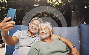 Relax, smile and senior couple with a selfie on an outdoor couch during retirement holiday in Spain. Happy