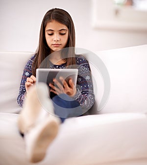 Relax, sofa or girl with tablet for elearning, playing games or streaming videos on a movie website. Education, online