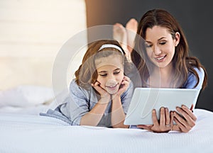 Relax, tablet and mom with child on bed at home watch online video on app, internet or social media. Smile, love and