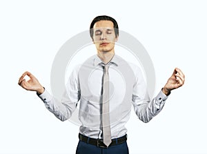 Relax and tranquility concept with handsom man with closed eyes in zen pose isolated on light wall background, close up