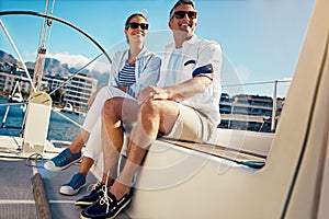 Relax, travel and luxury with couple on yacht for summer, love and sunset on Cape Town vacation trip. Adventure, journey