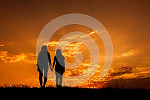Relax women standing and sunset silhouette