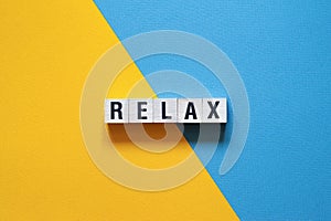 Relax - word concept on cubes