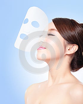 Relax Young woman with cloth facial mask