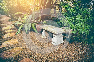 Relaxation corner with intricate granite bench. Vintage effect t