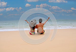 Relaxation the couple lying on the sand beaches -Summer vacation in a holiday concept