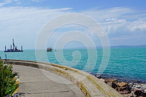 Relaxation peaceful landscape at the coast of Lake Balaton Hungary with turquoise clean water