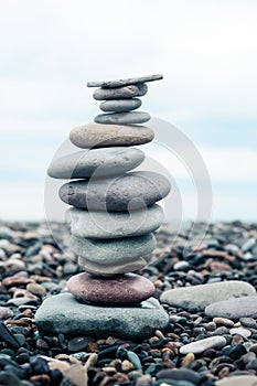 relaxation at sea. Stack of stones on beach - nature background.