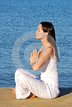 Relaxation yoga by the sea