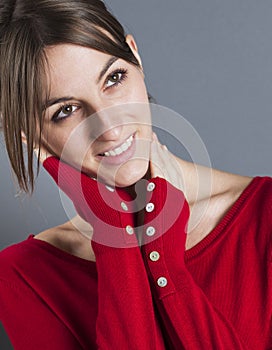 Relaxed 20s woman touching her face for happiness