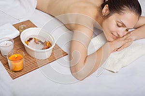 Relaxed adult girl before spa treatment
