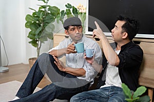 Conversation and Connection. Two men discussing over coffee in a cozy setting. photo