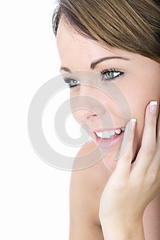 Relaxed Beautiful Young Woman Smiling with Hand on Cheek