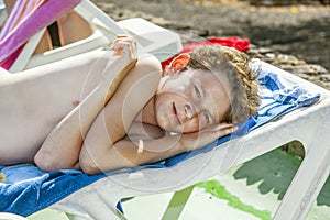 Relaxed boy enjoys lying on