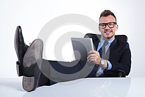 Relaxed business man with tablet