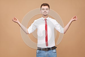 Relaxed businessman doing yoga poses