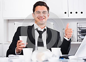 Relaxed businessman finishing work