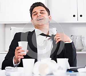 Relaxed businessman finishing work