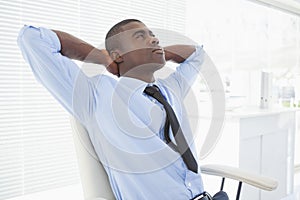 Relaxed businessman sitting in his chair