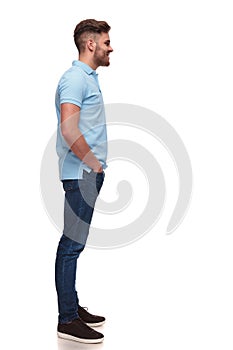 Relaxed casual man wearing polo shirt waiting in line