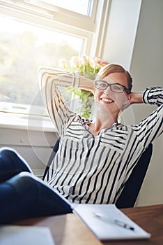 Relaxed confident successful businesswoman