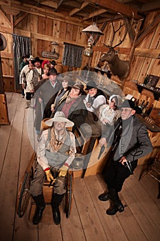 Relaxed Crowd with Guns in Saloon