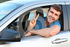 Relaxed driver showing peace sign