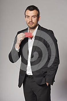 Relaxed fashionable man in suit standing casually