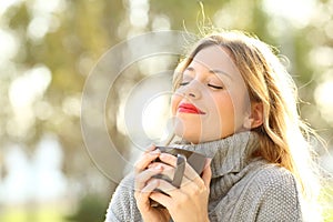 Relaxed girl breathing outdoors in winter