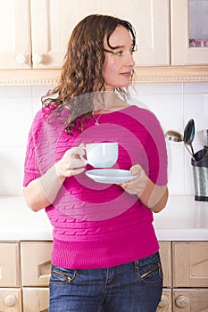Relaxed girl with cup of tea