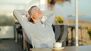 Relaxed girl resting in a coffee shop in slow motion