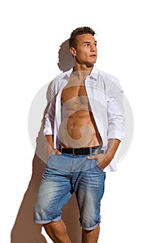 Relaxed Handsome Man In White Unbuttoned Shirt Looking Away