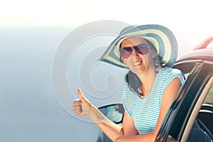 Relaxed happy woman on summer road trip travel vacation