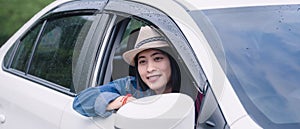 Relaxed happy woman on summer roadtrip travel vacation looking  at nature view out car window