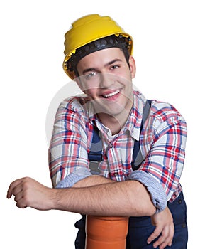 Relaxed hispanic construction worker with water pipe