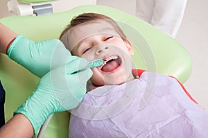 Relaxed kid in dentist chair