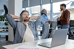 Relaxed man call center operator in headset having break