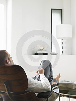 Relaxed Man Listening Music On MP3 Player