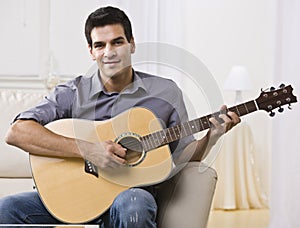 Relaxed Man Playing Guitar