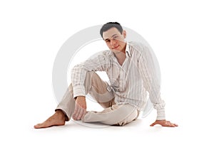 Relaxed man sitting on the flo